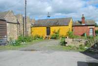 A ramshackle collection of buildings in the yards to the east of Hexham station in September 2006 (note the semaphore peaking out over the top).<br><br>[Ewan Crawford 26/09/2006]