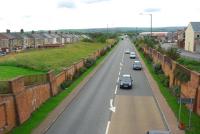 Looking away from the former station site. The road follows the route of the railway, a branch off to the right served the Consett Ironworks and a second link further away connected to the Low Yard.<br><br>[Ewan Crawford 26/09/2006]