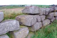 Nearby the of the two engine sheds at Waskerley is this pile of old stone sleepers. View looks north.<br><br>[Ewan Crawford 26/09/2006]