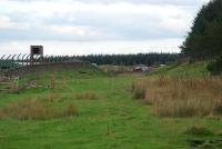 Looking south at Burnhill Junction. The route to Rowley came in from the left and that to Waskerley was to the right. The fencing of the Government store can be seen on either side.<br><br>[Ewan Crawford 26/09/2006]