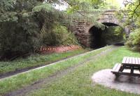 Scene at Rosslyn Castle station in October 2002. Trackbed, platform and station name embedded in the wall.<br><br>[Brian Forbes 02/10/2002]