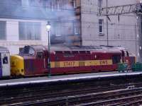 Having a camera on your phone comes in handy sometimes and this was too good an oppertunity to miss! 37417 hauling away the empty Caledonian Sleeper stock from Glasgow Central. A rare sight now as this service is normally done by Class 67 traction <br><br>[Graham Morgan 02/10/2006]