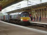 66402 passing through Paisley Gilmour Street with the WH Malcolm freight service from Elderslie heading for Grangemouth<br><br>[Graham Morgan 28/09/2006]