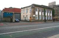 The demise of Leith's railway system was hastened by the arrival of the trams operated by both Edinburgh and Leith Corporations. The old Leith tram depot is seen looking east across Leith Walk in September 2006. The large tram shed is located behind the depot's former admin block, latterly used by the DSS. The Edinburgh Corporation depot was located a short distance to the south at Shrubhill. [See image 24094]<br><br>[John Furnevel 12/09/2006]