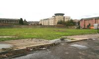 View south from the docks in September 2006 with the site of South Leith station off to the left on the far side of the wall beyond Tower Street. Much of the area in between was once occupied by the sidings and goods sheds of Leith General Warehousing. Ironically the area may well see rails again, being one of the sites shortlisted by Edinburgh Council for the new Edinburgh tram depot.<br><br>[John Furnevel 12/09/2006]