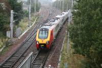 On a wet 6 October 2006 a Virgin Voyager service from Edinburgh Waverley, having left the Edinburgh line at Carstairs East junction, joins the up WCML at Carstairs South (formerly Strawfrank) Junction. <br><br>[John Furnevel 06/10/2006]