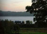 Network Rail 'Leaf Train' (as I call it) heading west towards Cardross as the sun sets. This cute little train magically appears every Autumn to clear away fallen leaves.<br><br>[Beth Crawford 12/10/2006]