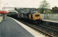 37412 running west through Drumchapel with the afternoon lengthy freight to Fort William<br><br>[Brian Forbes /04/1991]