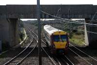 Southbound Ayr service takes the line to Troon (New). Straight ahead is orignal route and in the left foreground is the re-alignment of the original Kilmarnock and Troon Railway.<br><br>[Ewan Crawford 06/10/2006]