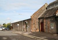 At the northwest corner of Lockerbie station stands the shell of the trainshed of the former Dumfries, Lochmaben and Lockerbie Railway which once supported an overall roof - removed in the 1970s, seen here in October 2006.<br><br>[John Furnevel 12/10/2006]