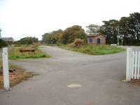 Tain, entrance to what was once the goods yard. Now with rusty sidings and lots of weeds. 16/10/06<br><br>[John Gray 16/10/2006]