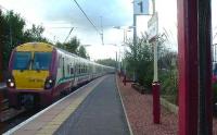 334030 pulling into Johnstone with a Glasgow bound service<br><br>[Graham Morgan 09/10/2006]