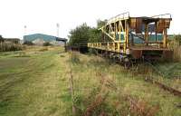 A mobile ramp used to load cars onto double-deck Cartics rusting away in the southwest corner of Leith South yard in October 2006. The former Leith South goods depot stands in the background.<br><br>[John Furnevel 15/10/2006]