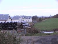 Site of Blairadam, the 1930 closed station was past the houses in the gap between them and the field.The former goods yard is under the houses.<br><br>[Brian Forbes /10/2006]