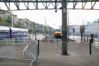 The planned platform renumbering omits 5 & 6, positions currently occupied by the 2 short ex-Motorail loading bays (note the ramps) and used primarily nowadays for stabling sleeper locomotives. The bays are seen on 22 October 2006 from the east end of the car park. Obvious potential exists here for any longer term expansion that may be required to east end platform capacity.<br><br>[John Furnevel 22/10/2006]