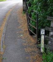 Alongside a road bridge over the Barnard Castle to Tebay/Penrith line 200 m west of Lartington Station in June 2013. A boundary marker showing the limit of railway property. [With thanks to Messrs McIntyre, Geddes and Bowker]<br><br>[Brian Taylor /06/2013]