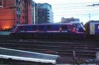 90019 being hauled away along with the empty Caledonian Sleeper. This is one of the Class 90s painted in First Scotrail colours by EWS (note badge at cab ends) for use on the Caledonian Sleeper<br><br>[Graham Morgan 26/10/2006]