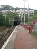 Looking east towards Port Glasgow, this is Whinhill station which was opened in 1990. To the right of the Cartsburn tunnel, behind the path, is the disued second tunnel<br><br>[Graham Morgan 25/10/2006]