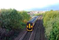 Westbound Sprinter at the site of Possilpark station. The replacement Possilpark and Parkhouse station is behind the camera.<br><br>[Ewan Crawford 28/10/2006]