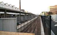 Platform 0 looking west over the barrier at the end of the bay on 29 October 2006. The car park is to the right of the black metal fence and platform 1 on the left behind the hoarding.<br><br>[John Furnevel 29/10/2006]