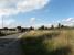 A new bridge is under construction over the Dunfermline-Alloa road.  The line from Kincardine joined the main Stirling-Dunfermline line (which was carried on the embankment on the right) at Kincardine Junction in the centre right of this picture.<br><br>[Mark Poustie 23/09/2006]