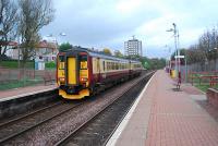 Glasgow bound service at Possilpark and Parkhouse. The Hamiltonhill Branch of the Caley crossed over the line beyond the green signal.<br><br>[Ewan Crawford 04/11/2006]