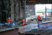 Put your back into it ... moving the fill for behind the new Balmoral platform by wheelbarrow. There is a curious road crossing of the trackbed.<br><br>[Ewan Crawford 11/11/2006]