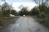 Currently unprotected crossing at Manor Powis. The station and later just the passing loop were to the east (left). The road provided access to the coalmine the bing of which later became a quarry.<br><br>[Ewan Crawford 12/11/2006]