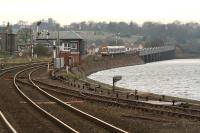 A Glasgow Queen Street - Aberdeen train comes off the 1881 14-span, South Esk Viaduct on the approach to Montrose station on a dull November afternoon in 2006. On the right of the photograph is part of Montrose Basin.<br><br>[John Furnevel 04/11/2006]