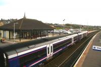 A southbound service stands alongside the modern station building at Montrose on a murky afternoon in November 2006 ready to commence the next leg of its journey to Glasgow Queen Street.<br><br>[John Furnevel 04/11/2006]