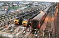 Looking over Clayhills carriage sidings, Aberdeen, early on a Sunday morning in November 2006. While much of the city is sitting down to breakfast and the Sunday papers, a GNER HST set (centre) is warming up prior to moving into the station where it will form the 0950 Aberdeen - Kings Cross. The second set will form the 11.42 service to the same destination, while the stock of the Aberdeen portion of the Caledonian Sleeper, will not be required for another 12 hours.  <br><br>[John Furnevel 05/11/2006]