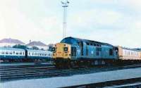 0400 on a midsummer morning at Eastfield in 1986. Loco 37018 (ML) sits in front of the Eastfield tool van, awaiting the arrival of the Fort William sleeper in the loop. The train will arrive via Springburn thus will have to be pulled down the hill to Queen Street from the rear as propelling passenger trains is frowned upon!<br><br>[Brian Forbes 19/06/1986]