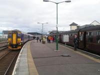 Hive of activity at Mallaig. Sprinter has just arrived from Glasgow whilst Jacobite prepares to depart.<br><br>[Paul D Kerr 04/09/2006]