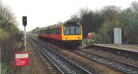 SPTE 107 croses the B757 and reaches Lenzie. Behind the train were two running loops and the branches from Bedlay and Gunnie.<br><br>[Brian Forbes //1989]