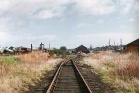 View east along the line from the viaduct over the River Findhorn to Forres sb avoiding the station (which is off to the right).<br><br>[Brian Forbes //1993]