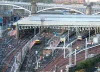 Sunday morning scene at the East end of Waverley on 19 November 2006. Several through roads are blocked by construction work. The GNER 0900 London Kings Cross service boards at no 21 (far left). In the loco bay is one of the EWS class 90s in First ScotRail livery used on the Caledonian Sleeper.<br><br>[John Furnevel 19/11/2006]