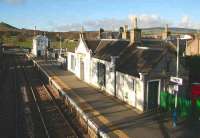 View north west from the pedestrian footbridge at Insch station in November 2006, looking towards the signal box and North Road level crossing.<br><br>[John Furnevel 08/11/2006]