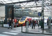 Passengers off a Virgin Voyager, recently arrived at Waverley from the south, disembark at the 'North Berwick platform' on 25 November 2006. (Old platform 7 - new platform 4).<br><br>[John Furnevel 25/11/2006]