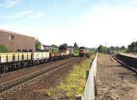 Looking north at Aviemore on 05 July 1991 as 47674 on a PW train stands in the siding opposite the SRS station as a pair of 37s arrives from the north. <br><br>[John McIntyre 05/07/1991]