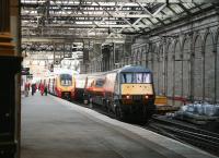 The 1500 GNER service to London leaves platform 11 on 25 November on the avoiding line via the crossover. The train is bypassing the Virgin 1505 to Birmingham New Street boarding at platform 10.<br><br>[John Furnevel 25/11/2006]