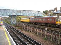 Classic <I>bubble car</I> DMUs, now used on sandite duties for Chiltern Railways, passing West Hampstead on 25 November 2006. [Railscot note: the station is on the Metropolitan and St John's Wood Extension Railway and the DMU is on the Harrow to Canfield Place Quadrupling (Great Central Railway).]<br><br>[Michael Gibb 25/11/2006]