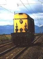 Class 20 running light towards Glasgow approaching Geilston LC in 1975.<br><br>[John McIntyre //1975]