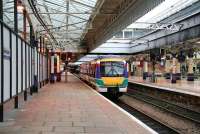 An empty train runs through Aberdeen platform 7 on a Sunday morning in November 2006.<br><br>[John Furnevel 05/11/2006]