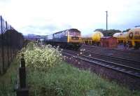 Southbound train on the ECML passes Craiginches Yard in 1975.<br><br>[John McIntyre //1975]