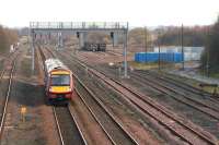 Looking east over Cadder Yard on 1 December 2006 as a Glasgow Queen Street - Dunblane service runs through.<br><br>[John Furnevel 01/12/2006]