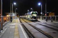 The NET tram system in Nottingham uses the former route of the Great Central to approach Nottingham (Midland) station. Here a tram sits at the terminus with the station beyond and below. Just to the north was the former Weekday Cross Junction. View looks south.<br><br>[Ewan Crawford 18/11/2006]