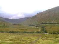 Looking back towards the smaller of the two Horseshoe Curve viaducts which crosses Glen Coralan. The slopes of Beinn Odhar rise prominently on the right.<br><br>[Paul D Kerr 04/09/2006]