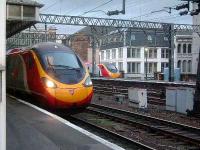 Two Class 390s at Glasgow Central waiting their turns to depart South.<br><br>[Graham Morgan 05/12/2006]