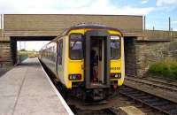 Southbound service from Wick stands at Georgemas Junction in August 1989 awaiting arrival of the the portion from Thurso.<br><br>[John McIntyre 15/08/1989]