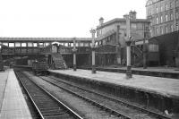 Beginning of the end. Demolition work on the Great North end of Aberdeen station in 1973. View south towards the main station over platforms 6-9 showing the old north end booking office and covered walkway.<br><br>[John McIntyre /02/1973]